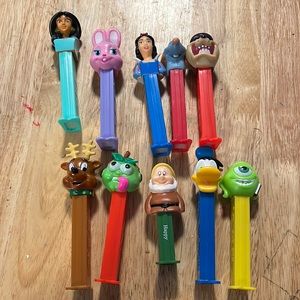 4 items for $9
 . Lot of Pez Dispensers. Snow White ratatouille Taz Mike Donald
